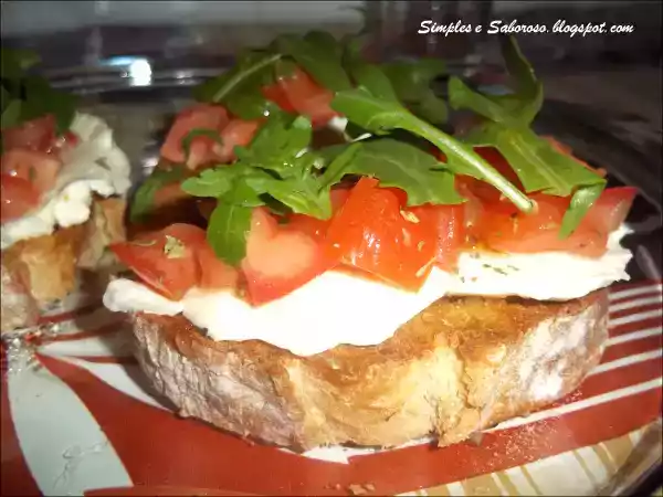 Receita Bruschetta de queijo, tomate e rúcula