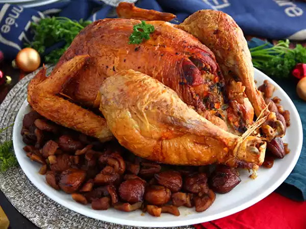 Receita Galo capão recheado com castanhas