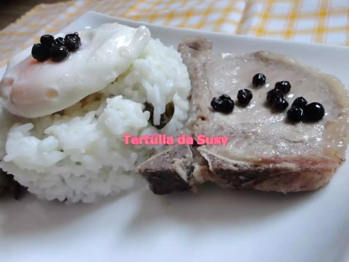 Costeletas de porco ibérico com arroz de alcaparras e ovo a cavalo - foto 2