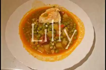 Ervilhas guisadas com chouriço e ovos escalfados