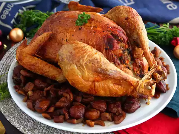 Receita Galo capão recheado com castanhas