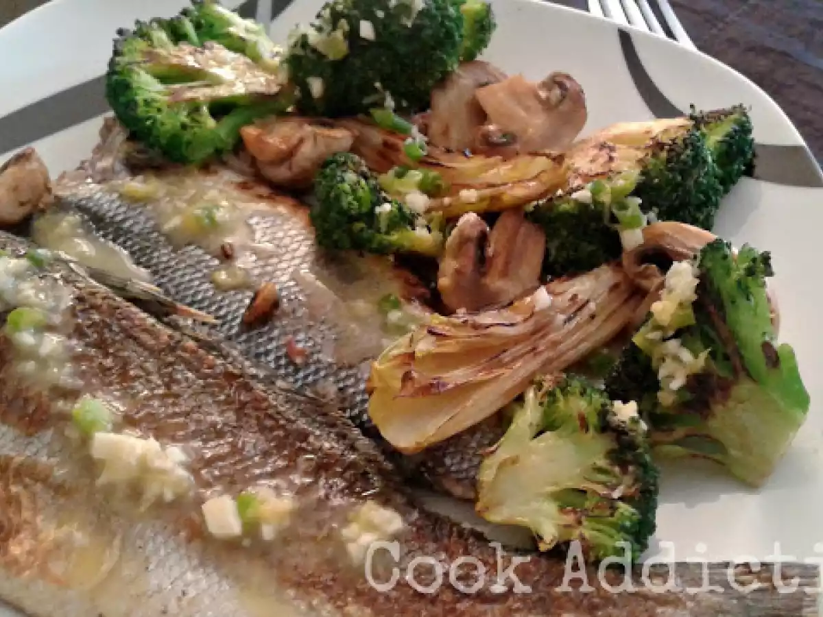 Robalo e legumes grelhados com molho de manteiga e alho